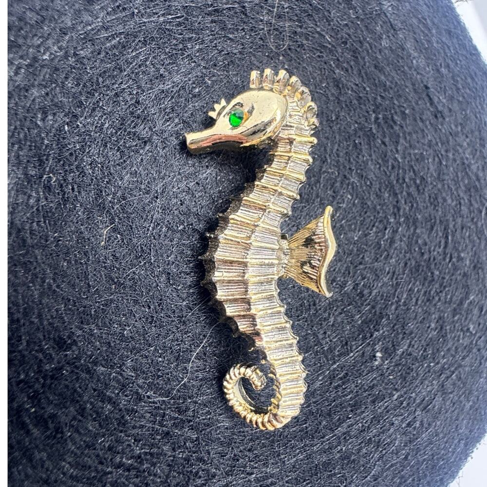 Vintage gold toned sea horse brooch with green eye rhinestone MCM‎